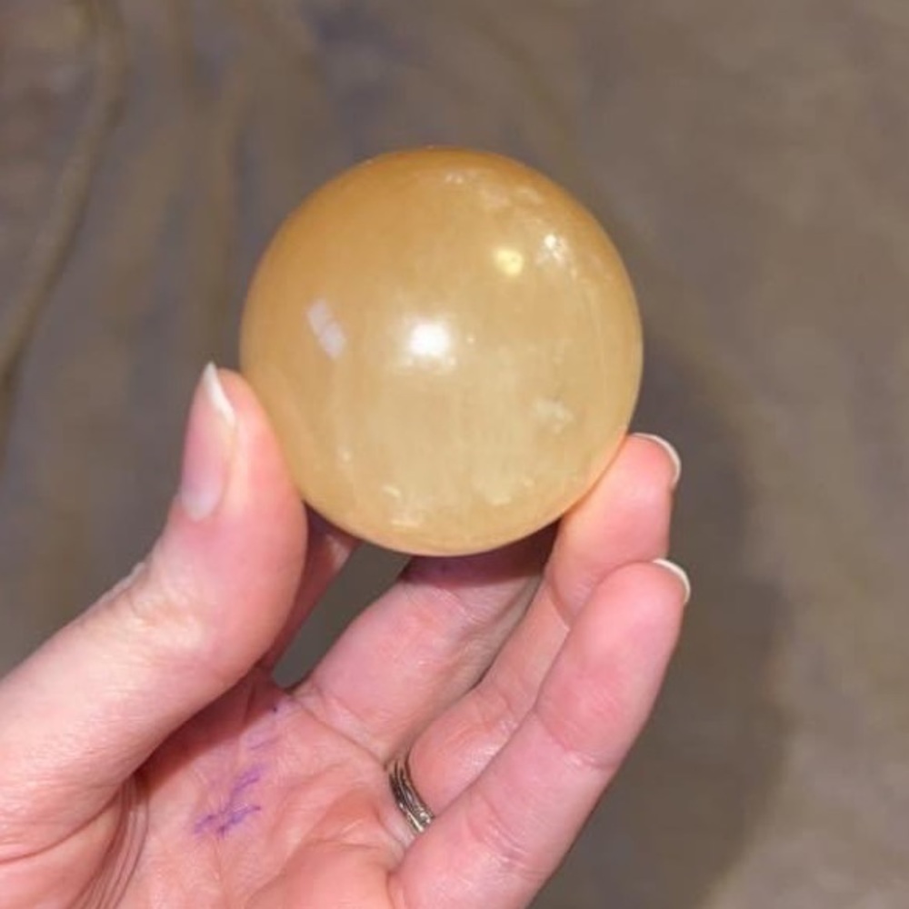 Honey calcite sphere with star